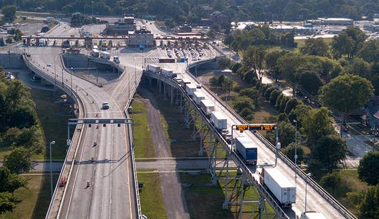 cross-border-shipping_listing image.jpg aerial view of trucks at the border crossing
