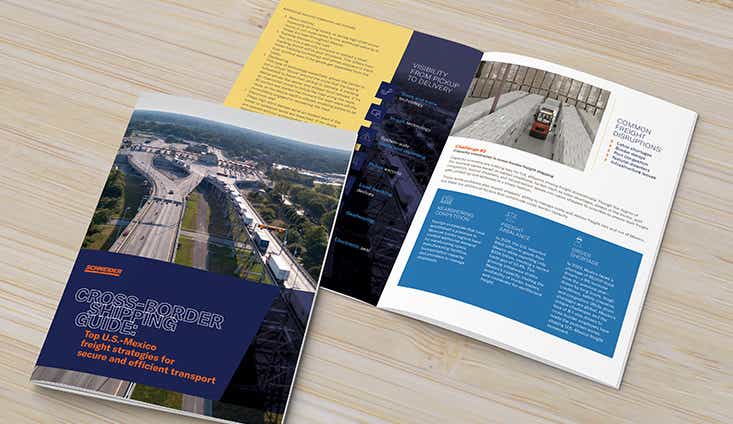 Cross-border shipping brochure opened  on light wood surface