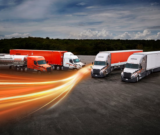 four Schneider trucks parked in a row representing multimodal modes