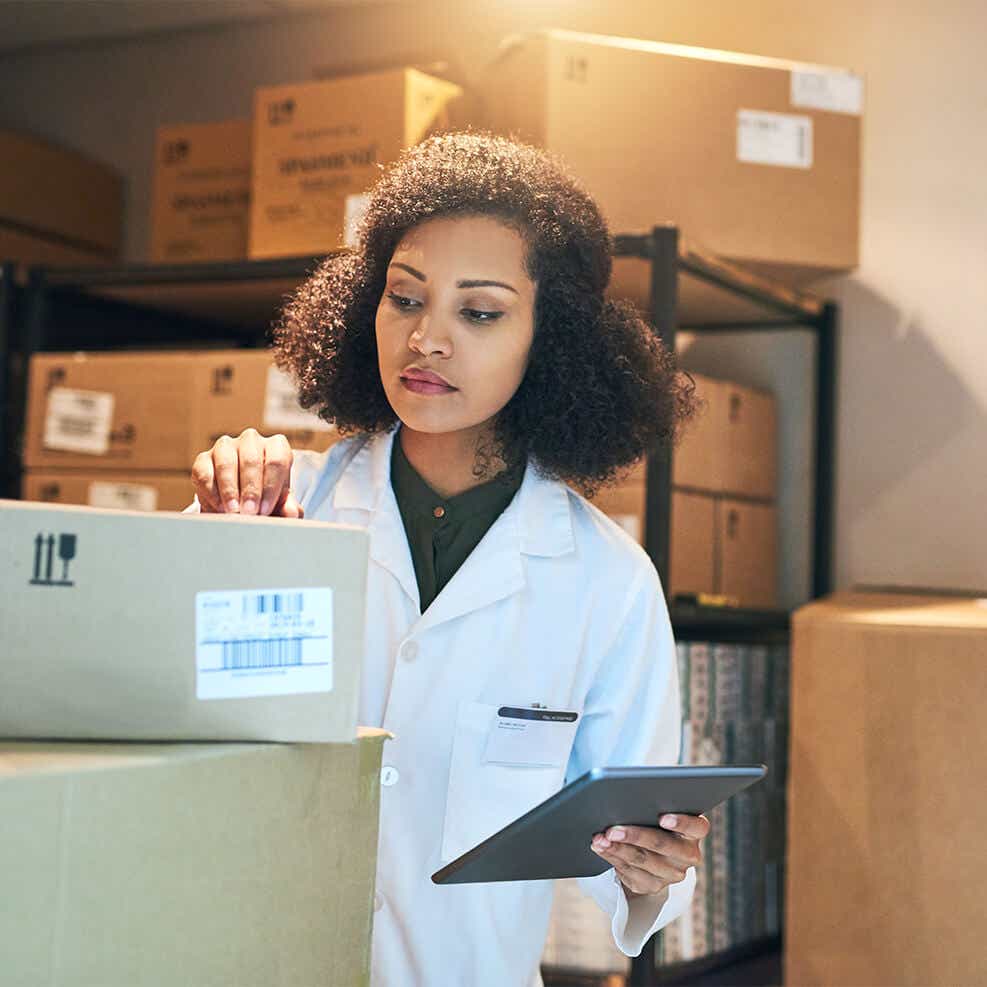woman reviewing medical shipment