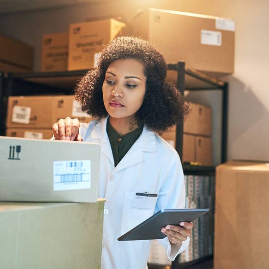 woman reviewing medical shipment