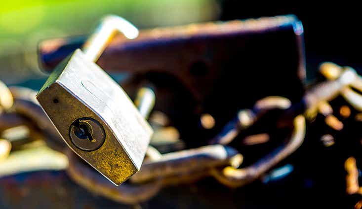 A close up of a lock and chains
