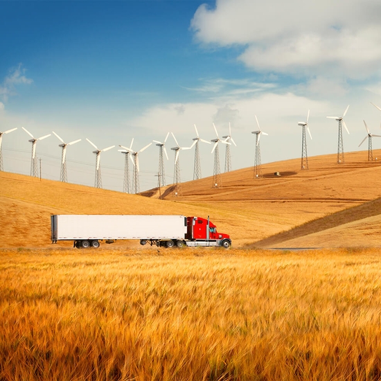 truck driving in the middle of agricultural fields