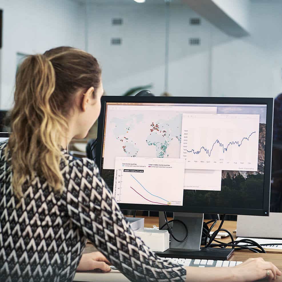 Woman looking at transportation index pricing on computer