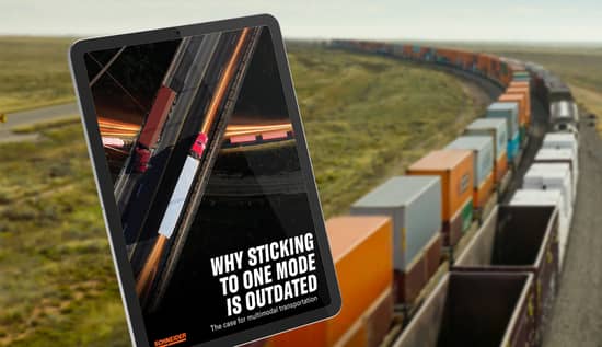 Tablet screen displaying guide to "Why sticking to one mode is outdated" with a train carrying cargo in the background