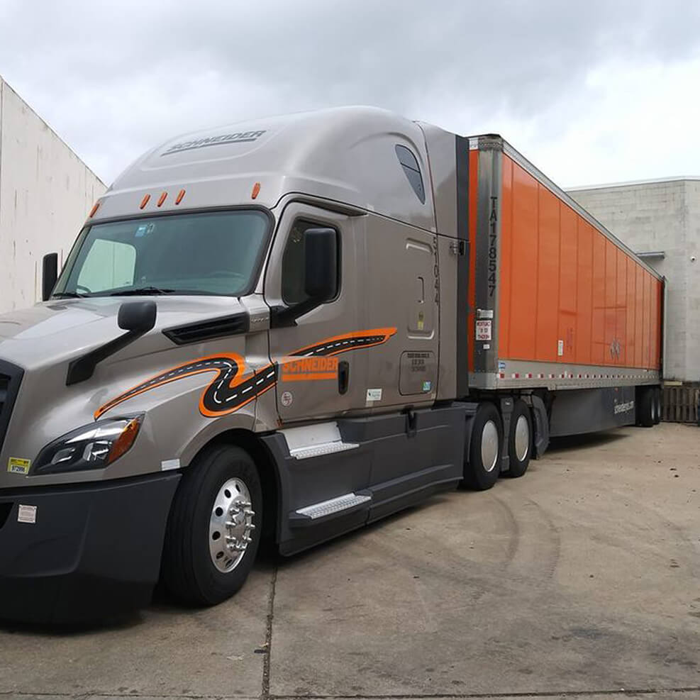Schneider truck transporting CPG goods safely