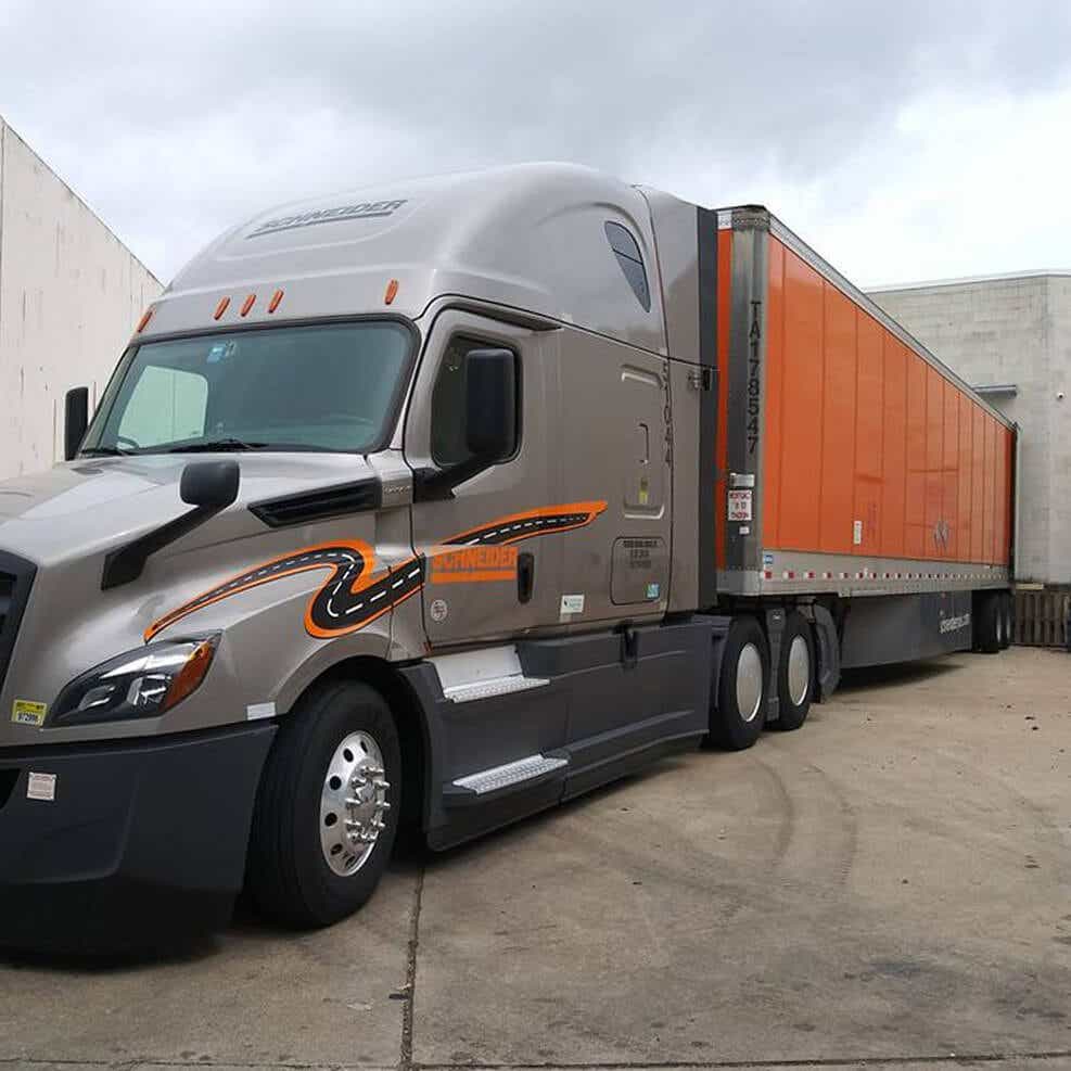 Schneider truck transporting CPG goods safely