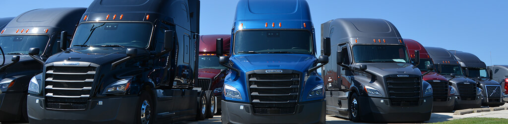 A blue semi-truck parked in a parking lot