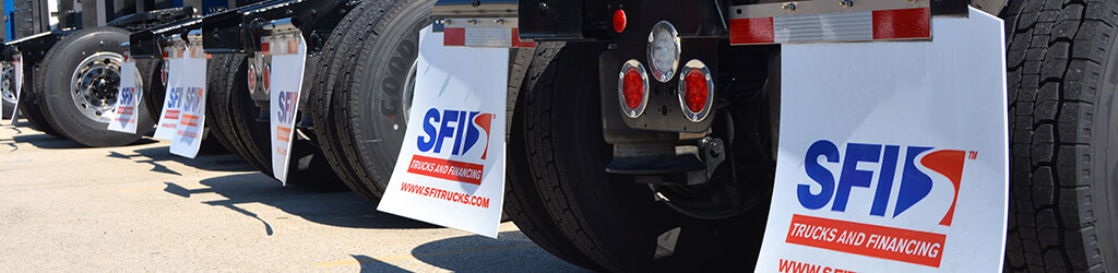 A row of semi trucks from the back side, displaying mud flaps with SFI's logo and website