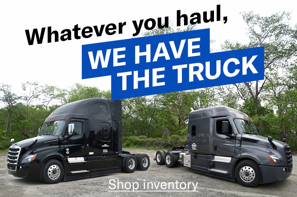 A 2025 VTL Freightliner and a 2025 Bulk Freightliner parked in a gravel parking lot with the words "Whatever you haul, we have the truck" placed over it and a "Shop inventory" link button.