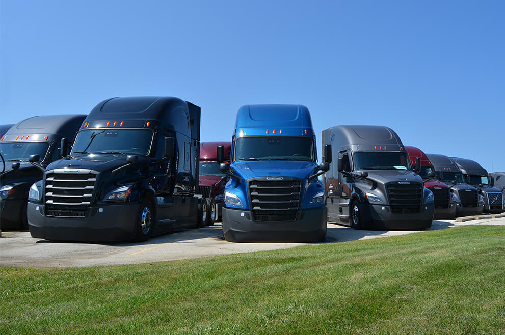 A row of semi trucks available for lease at SFI