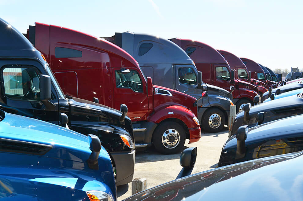 New truck models line the lot at an SFI facility