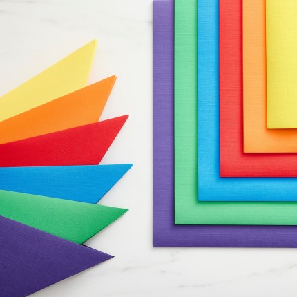 colorful paper laid out creatively on a white paper