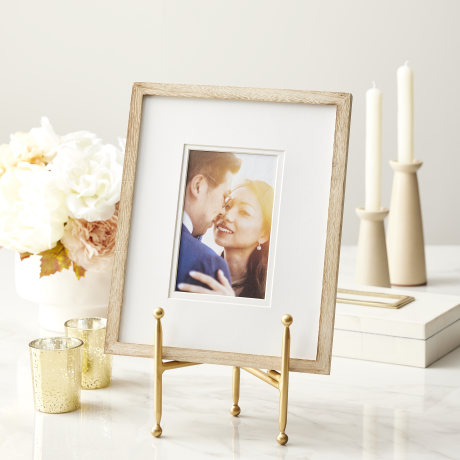 Gold picture stand holding a frame