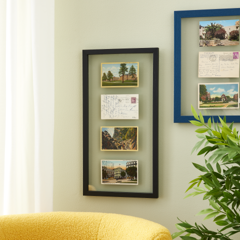 Post cards displayed on a vertical float frame