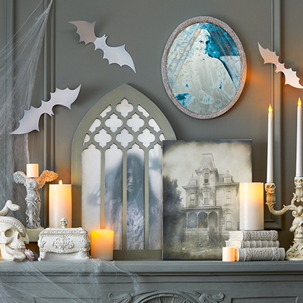 White and grey halloween decorations with some candles