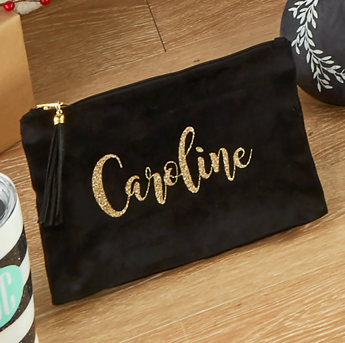 A velvet pouch with gold letters