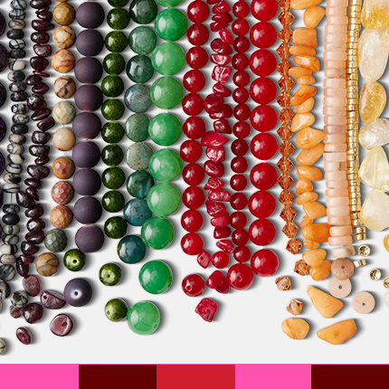 black, green, red and yellow assorted beads in rainbow order