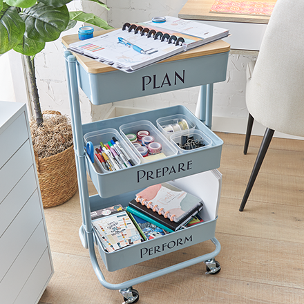 blue rolling cart with office supplies