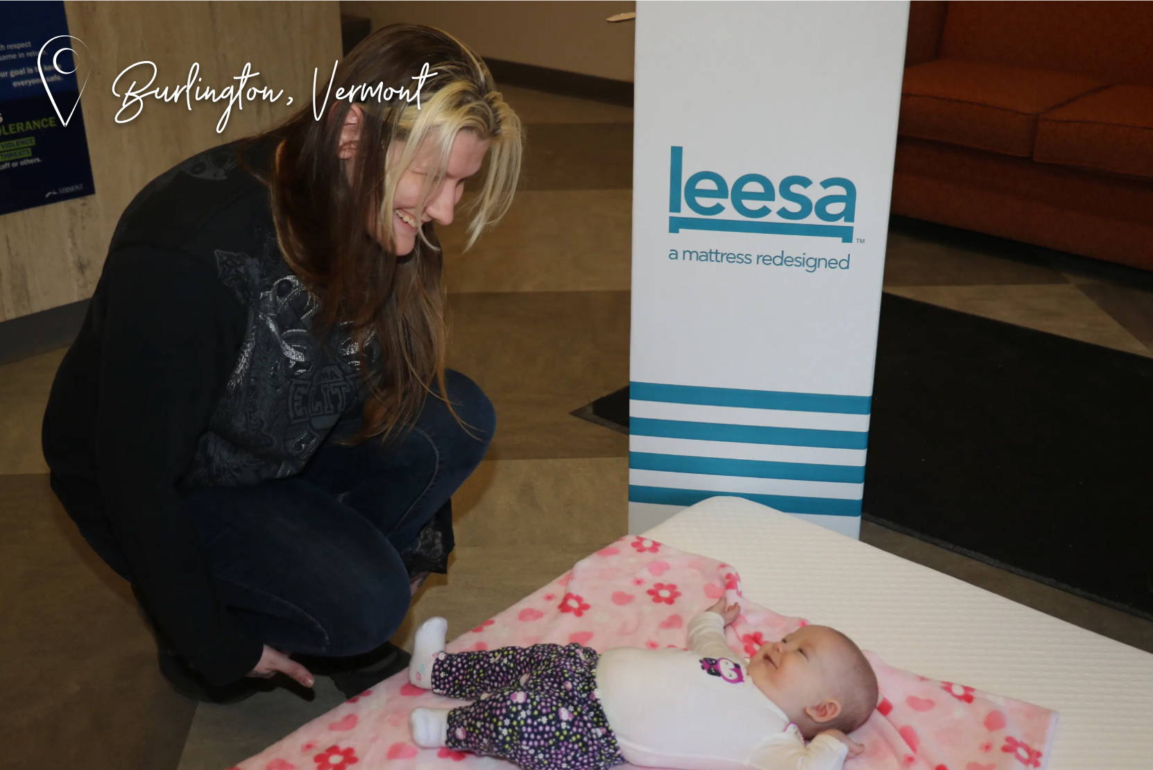 Burlington, Vermont, women leaning over baby laying on Leesa mattress