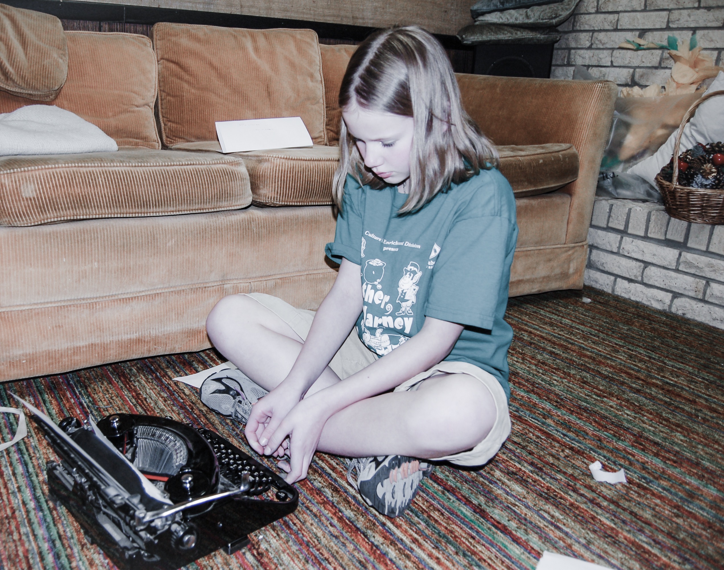 Young Zoe with typewriter in her grandparents basement