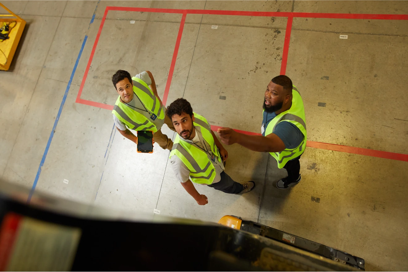 seasoned warehouse workers introducing a new warehouse worker joining the team after he read about their workplace culture and decided to apply for the job