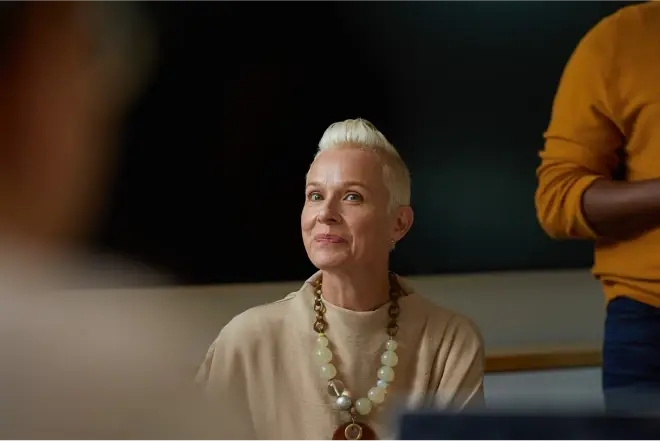 a mature professional woman appreciating the Company Page she saw that led her to her current job in an inclusive work environment