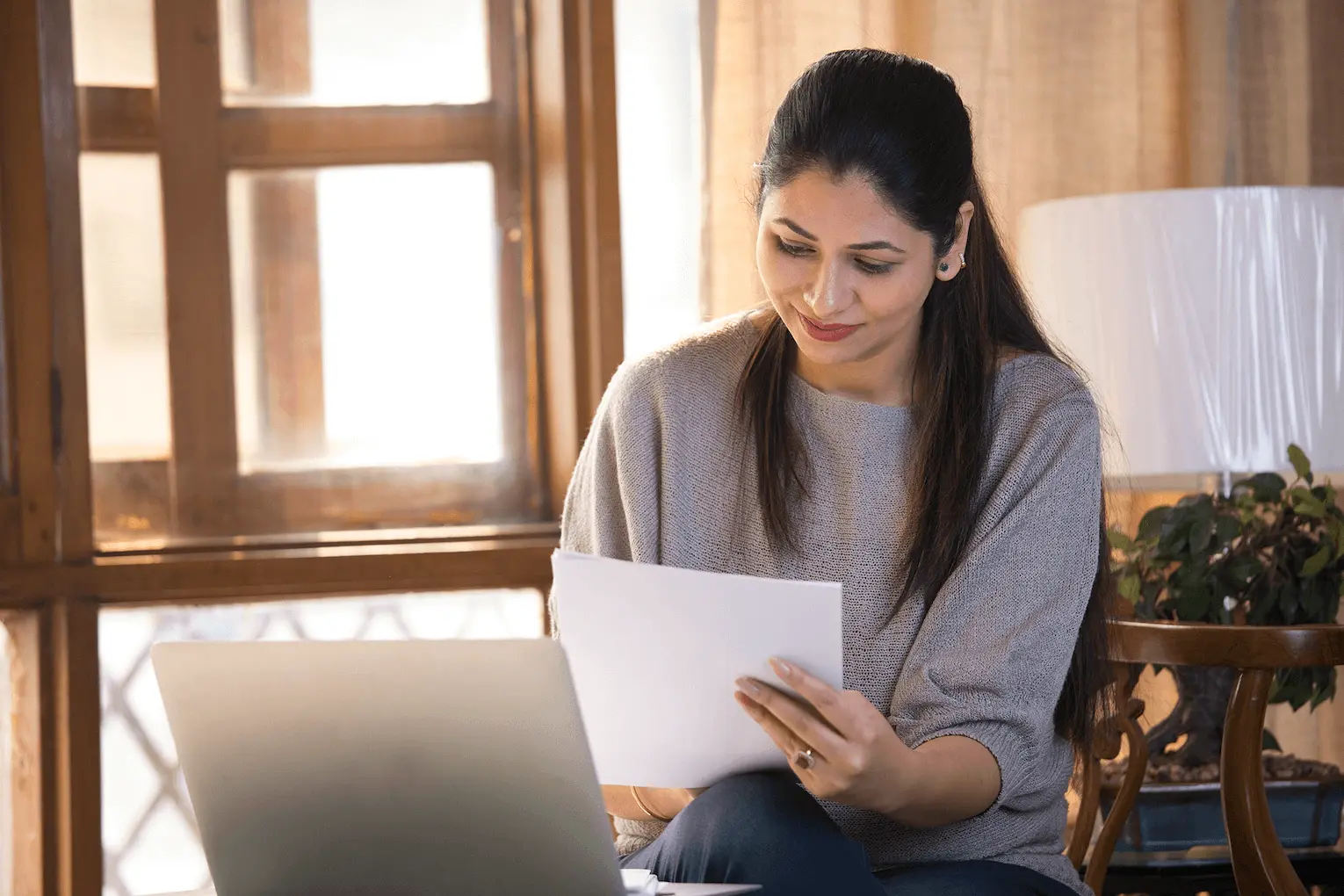 a young professional exploring Indeed’s matching and hiring platform on a laptop