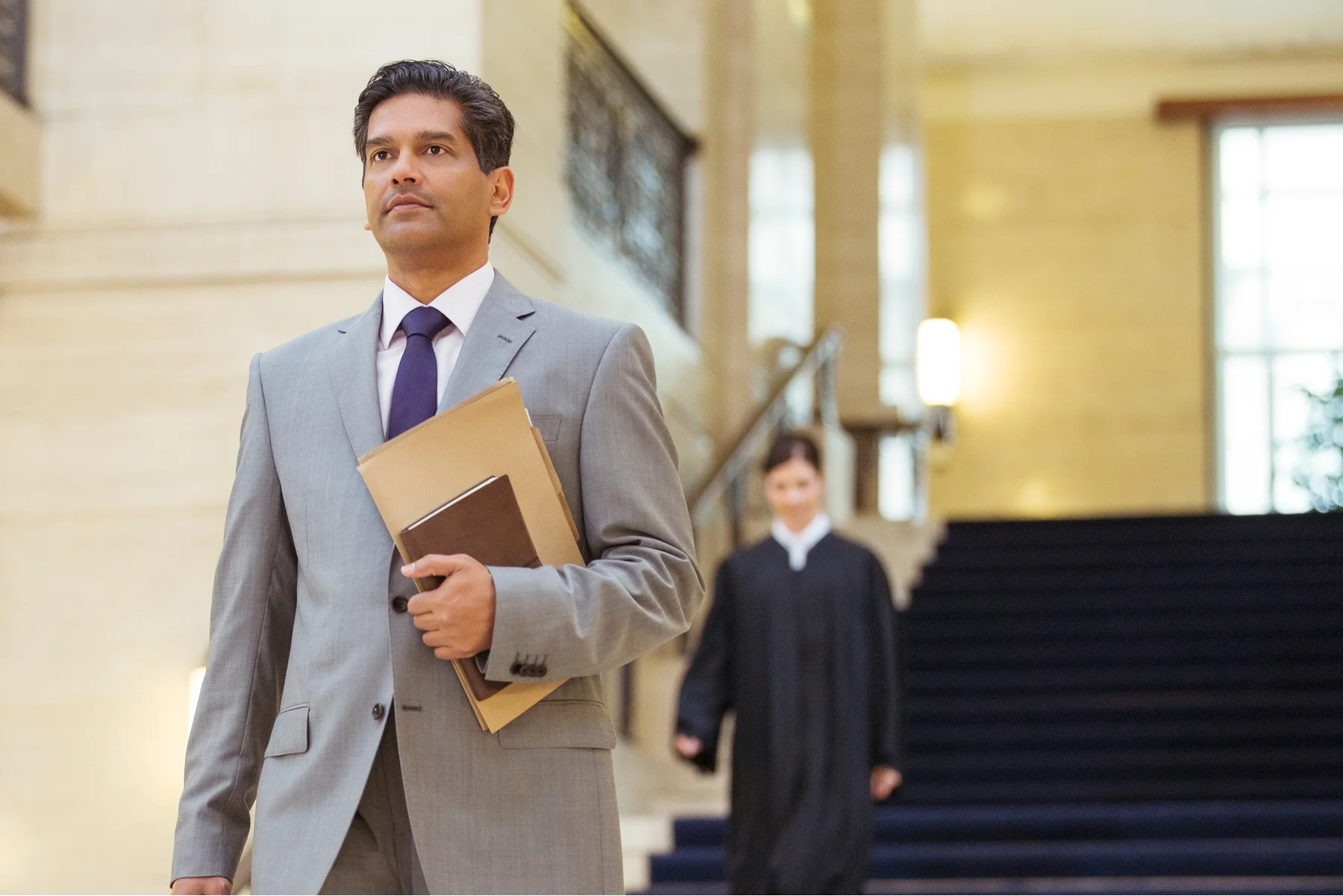 A man in a suit walking confidently