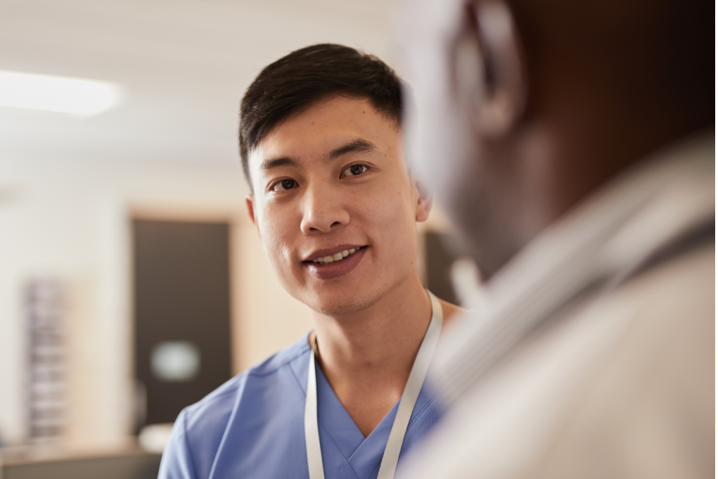 A healthcare professional interviewing with a non-visible colleague