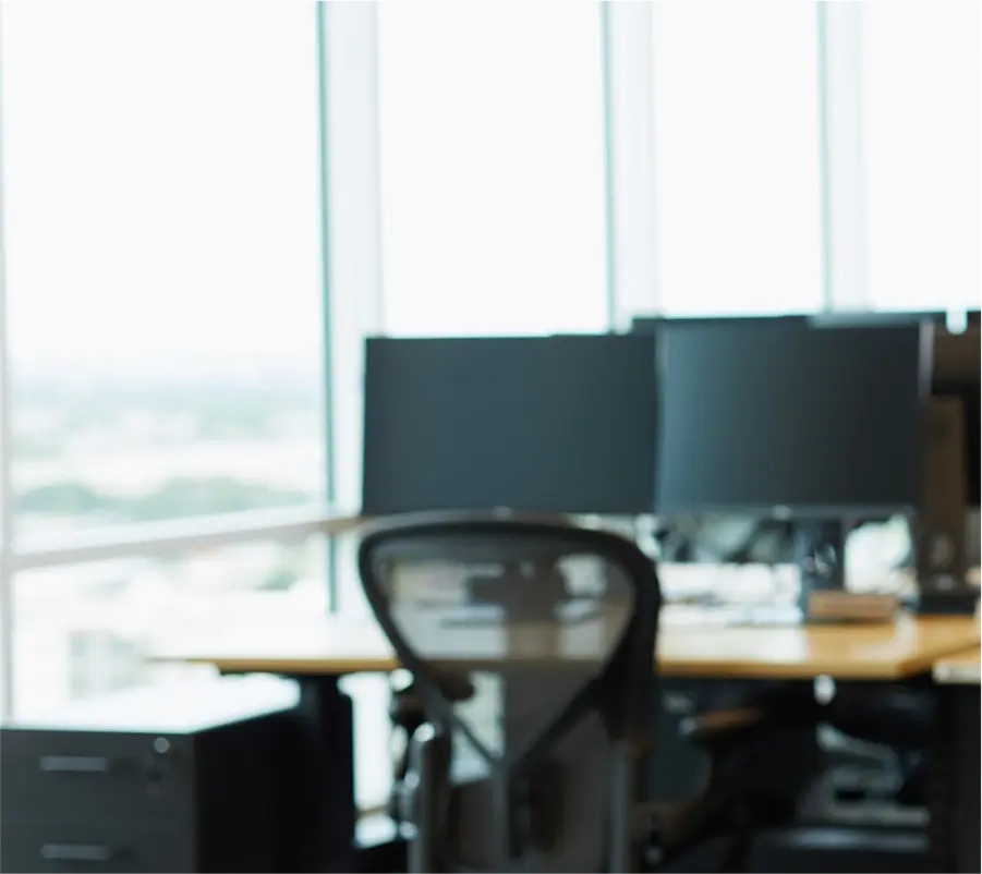 a young professional woman wearing long gold earrings prepares to use Indeed’s matching and hiring platform to make her next hire