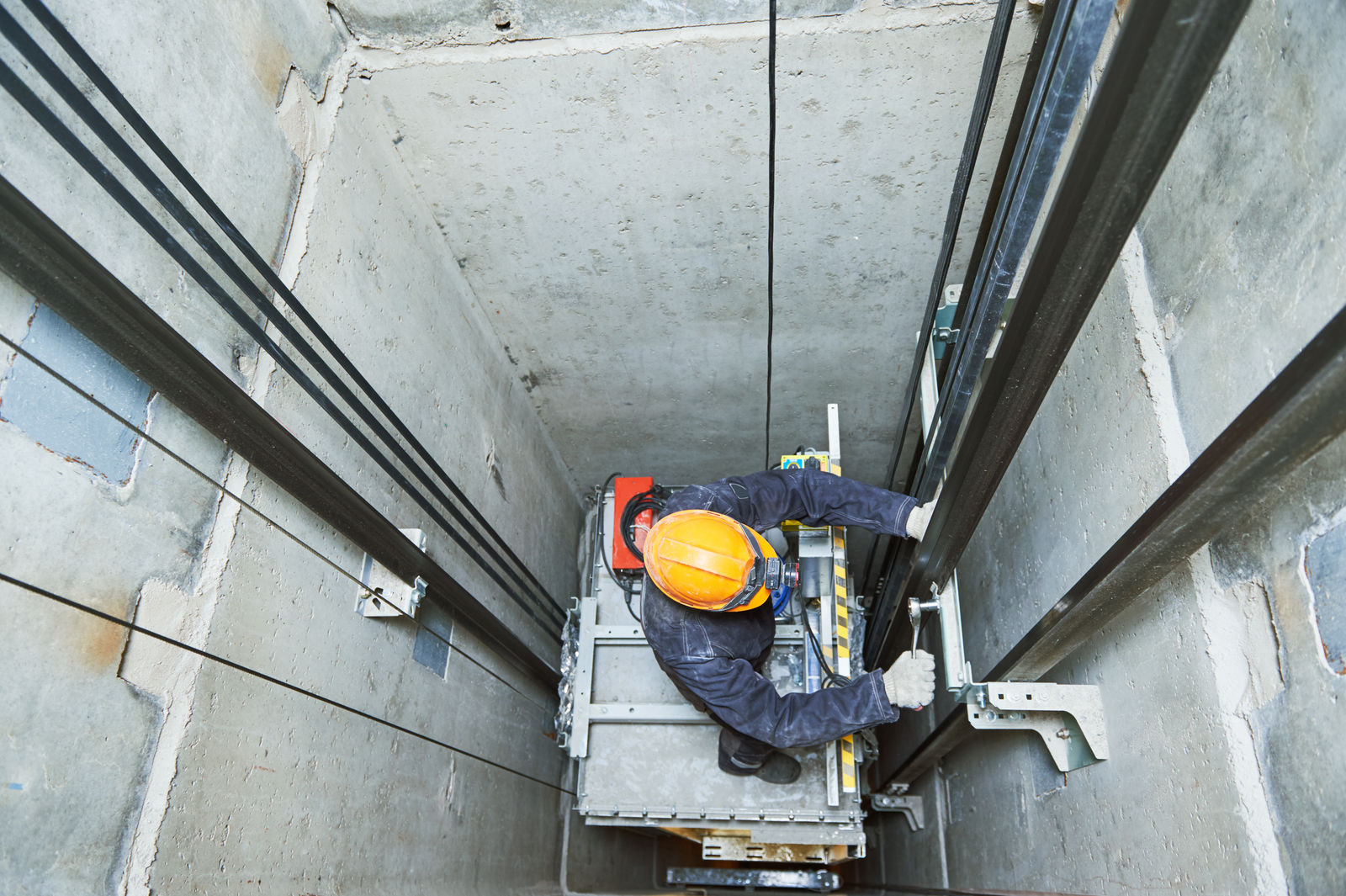 elevating-technician-fixing-elevator-shaft-safety-medium.jpg
