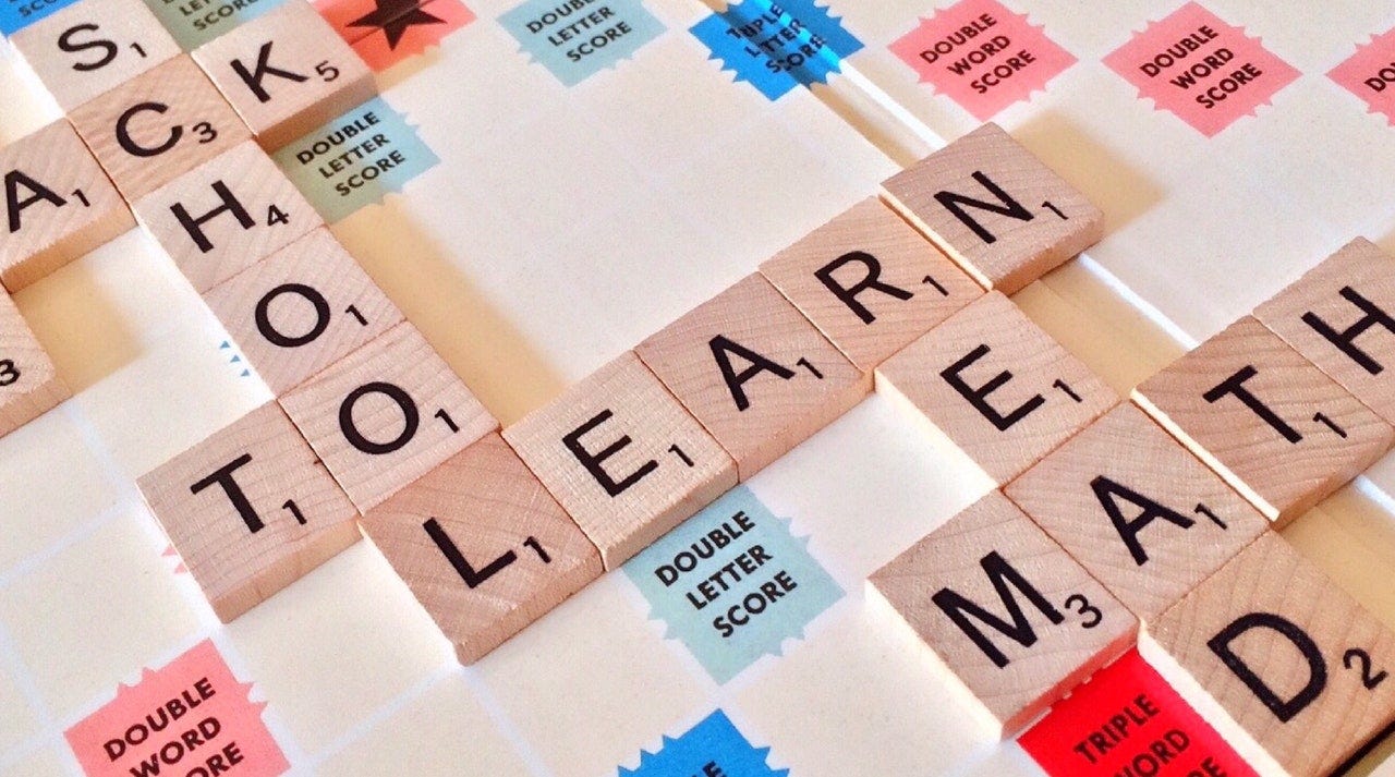 A game of Scrabble spelling the word Learn