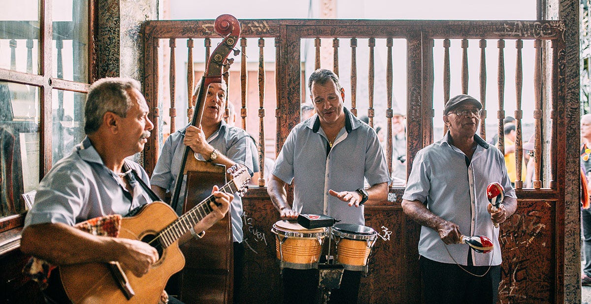 A band of four musicians playing music