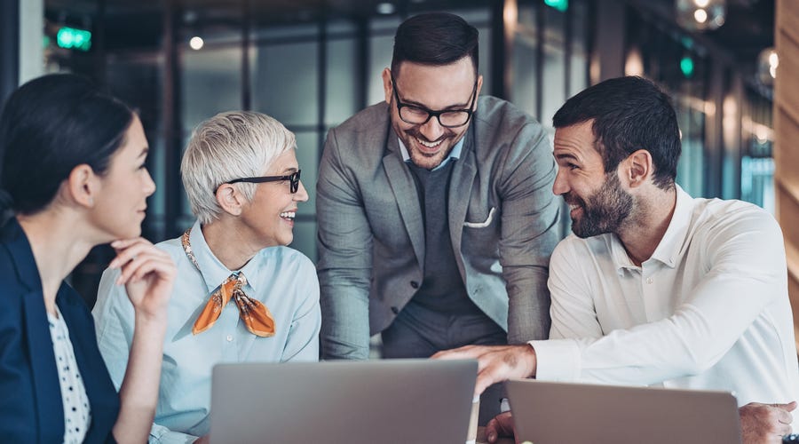 Group of colleagues talking about business English in the workplace