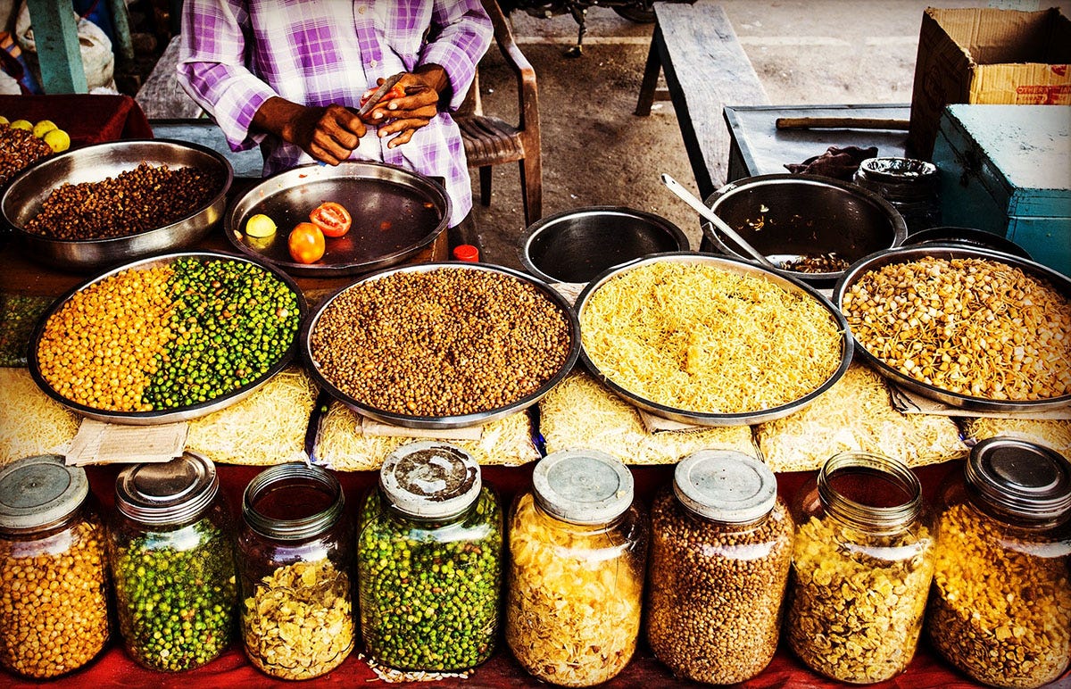 Different kinds of spices in jars and bowls