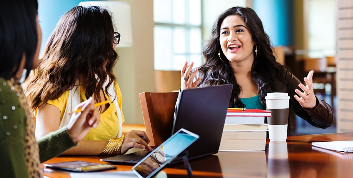 Women working in human resources talking to each other in the office