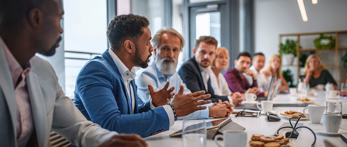 Man talking during a business meeting using business English vocabulary