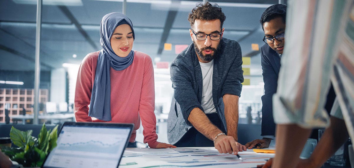 A team of marketing specialist making plans at a table