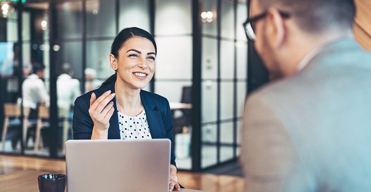 Woman talking to a customer and using business English vocabulary