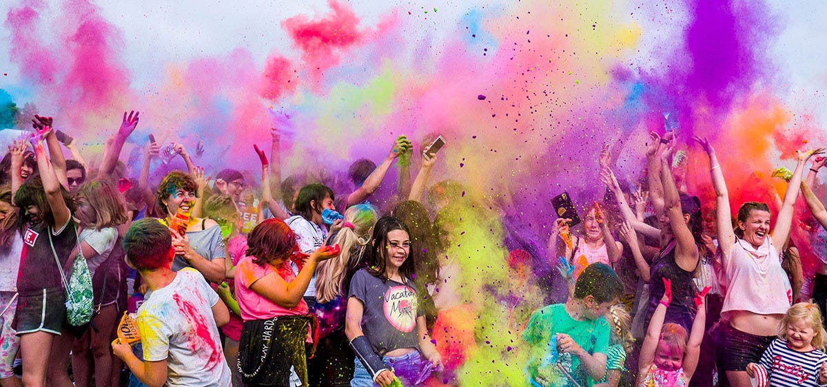 People celebrating in a colorful festivity