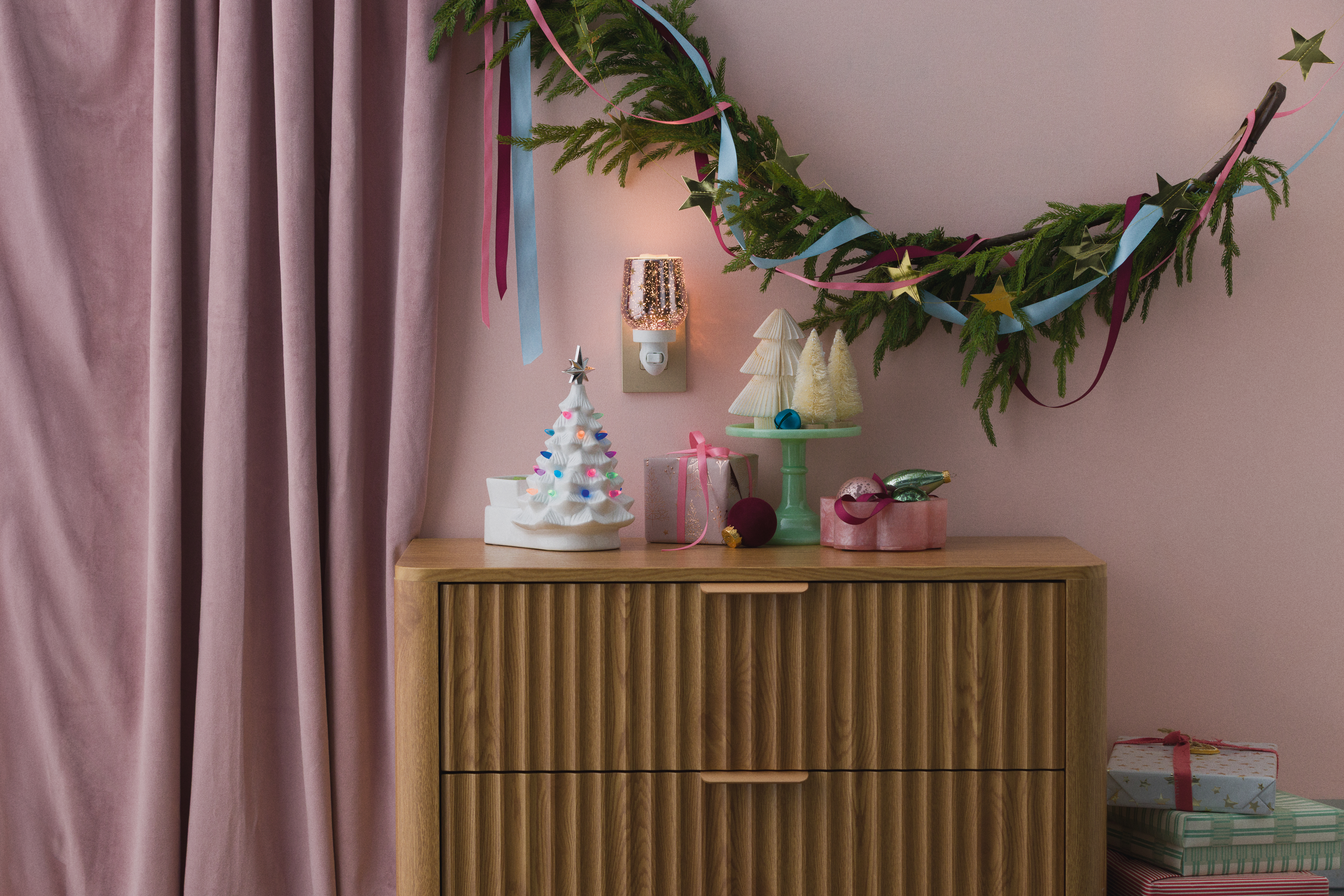 Scentsy Pink Christmas collection warmers and fragrances styled in a sweetly festive pink holiday setting.