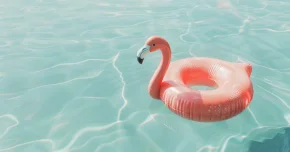 An inflatable flamingo floating in a swimming pool