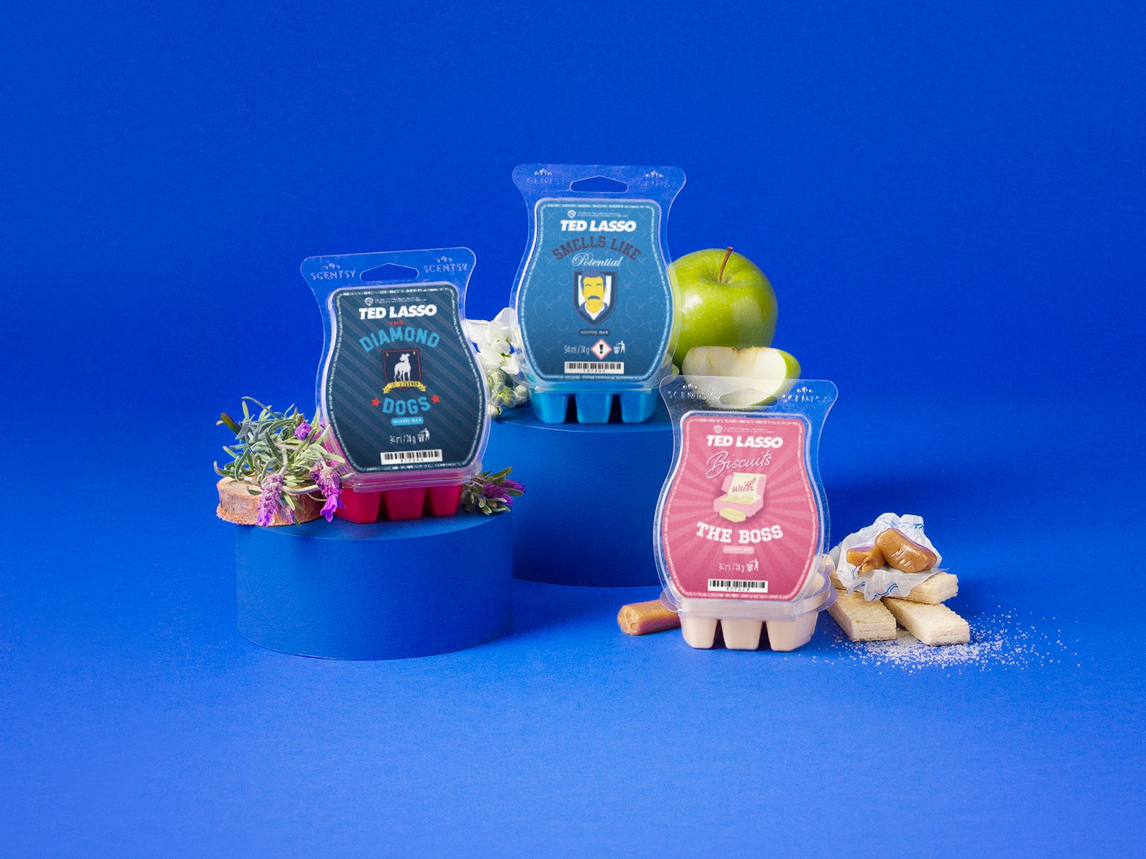 Ted Lasso Collection products are displayed with fragrance ingredients against a blue background. 