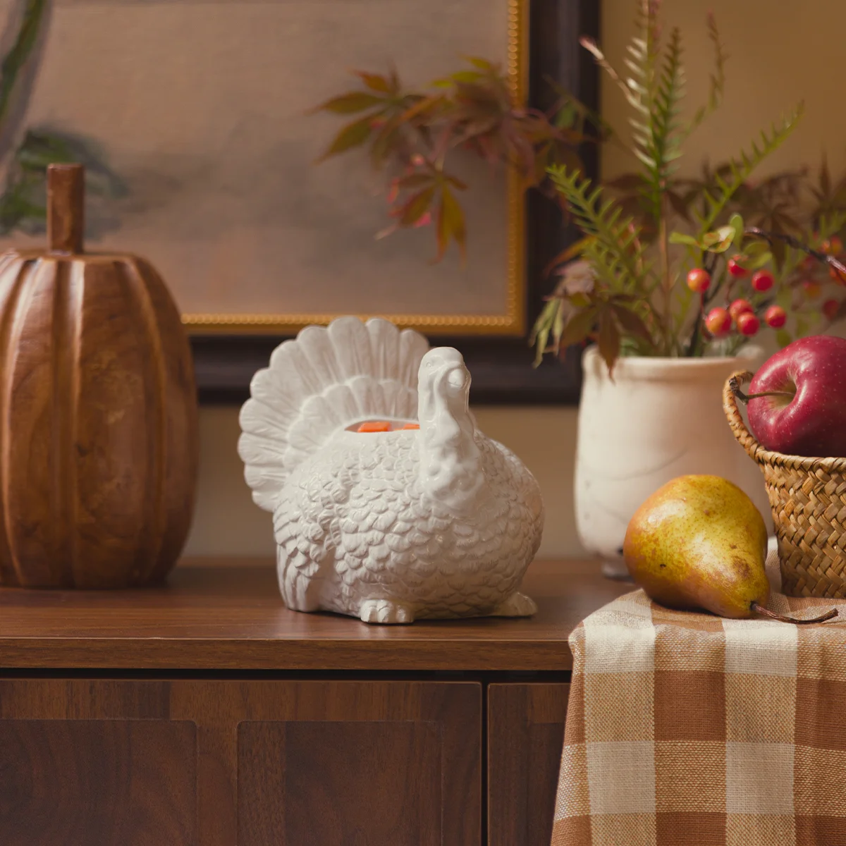 Feathered Friend Scentsy Warmer pictured on a table filled with autumnal decor