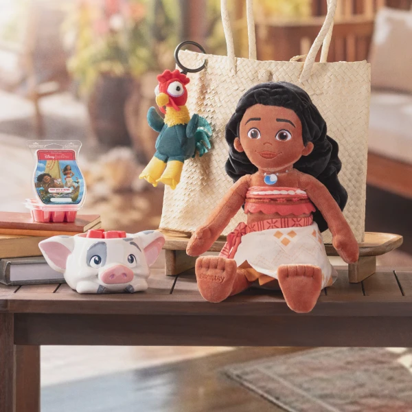Disney Moana Collection products are displayed on a table with a large straw bag.