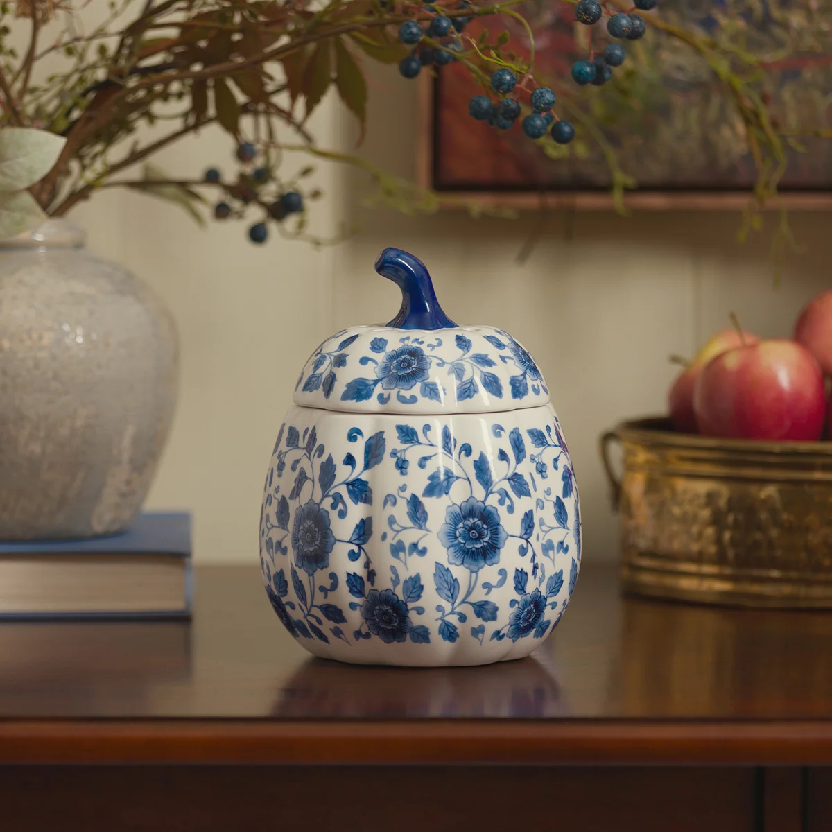 An Indigo Vine Pumpkin Warmer is featured with other Harvest Collection products in a cozy kitchen setting.