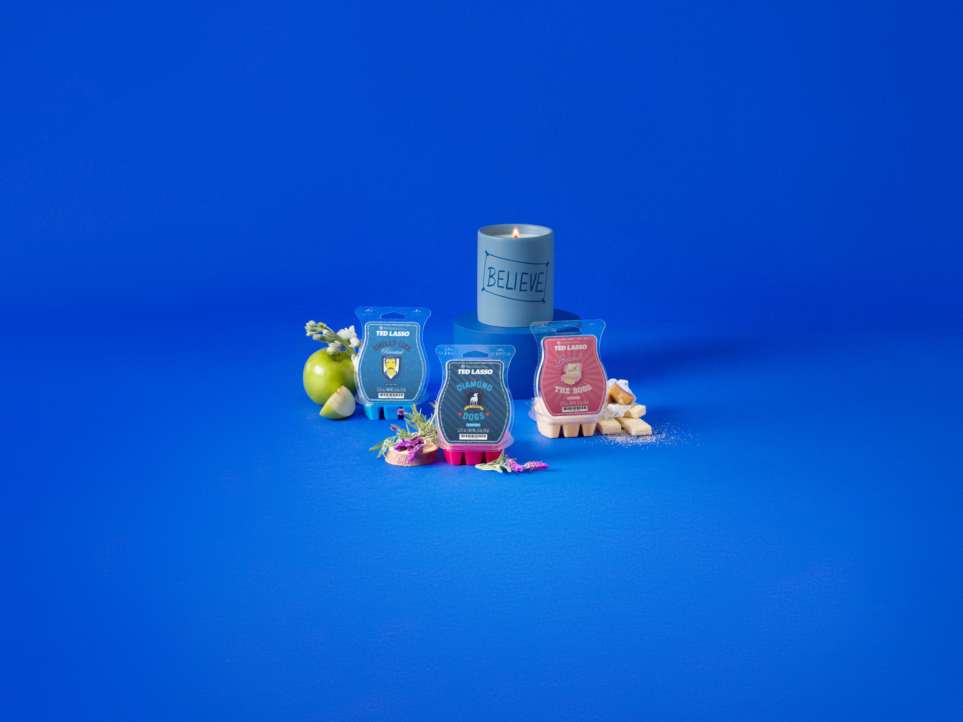 Ted Lasso Collection products are displayed with fragrance ingredients against a blue background.