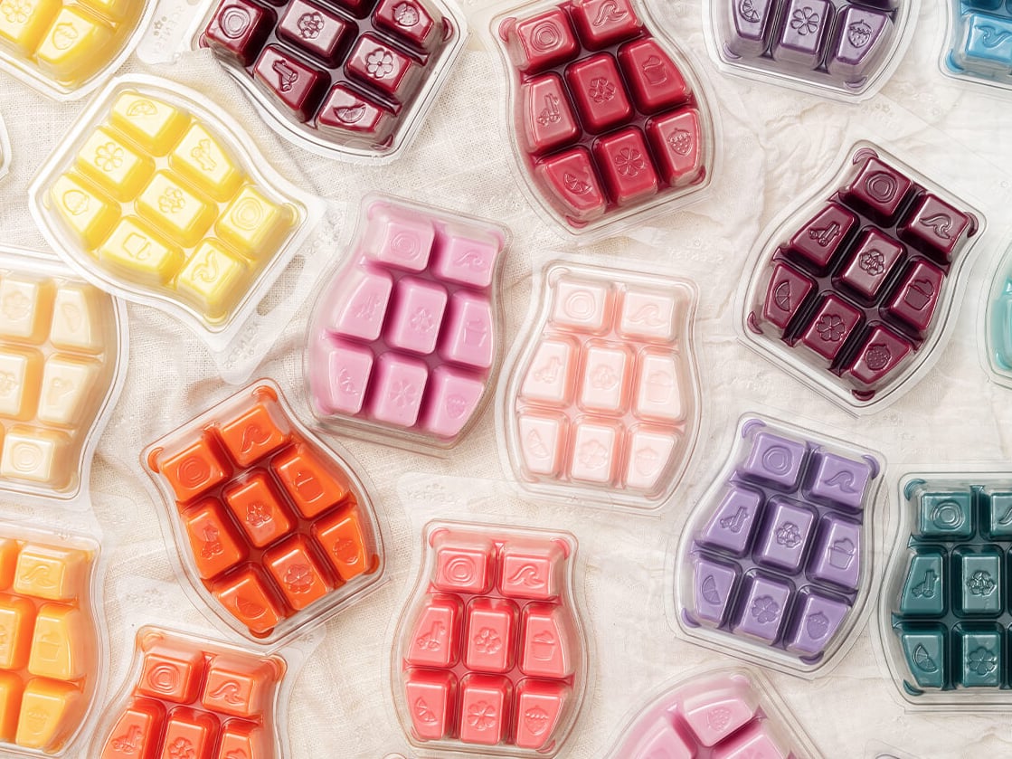Scentsy Bars of various colors displayed on a white background