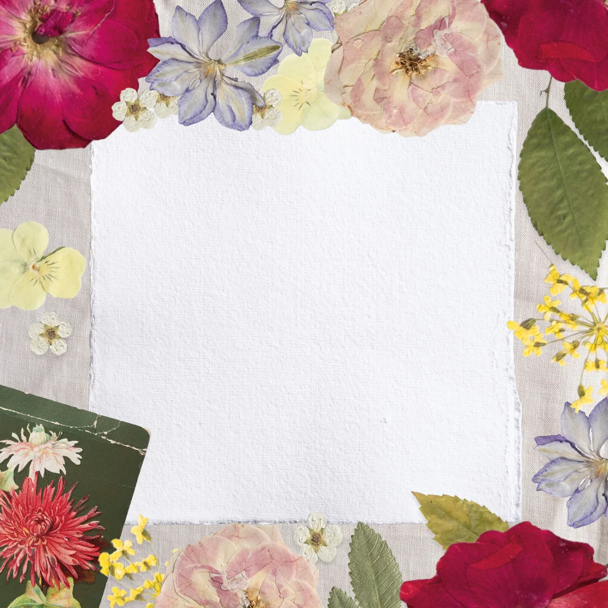 Pressed scrapbook style florals frame a white square. 